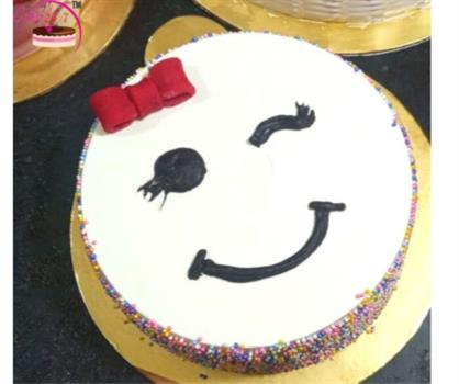 Winking Emoji face Colourfull Sprinkle Cake